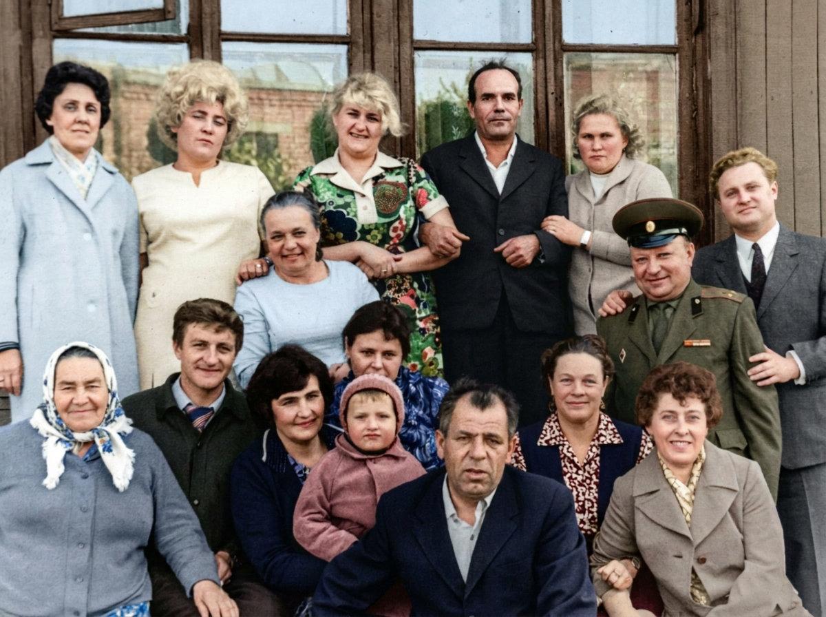 The same family group photo, restored and colorized